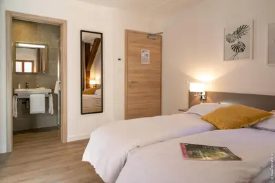 Un ou plusieurs lits dans un hébergement de l'établissement Hôtel le Saint Nicolas