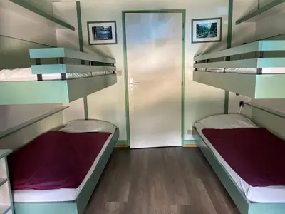 Un ou plusieurs lits dans un hébergement de l'établissement Auberge des Skieurs