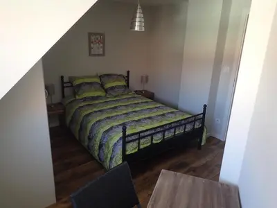 Un ou plusieurs lits dans un hébergement de l'établissement Les Gîtes de la tour, appartement 