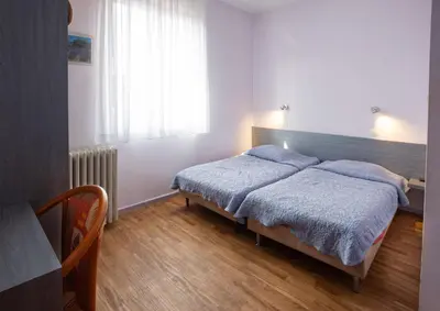 Un ou plusieurs lits dans un hébergement de l'établissement Hôtel du Ladhof