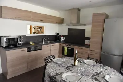 Cuisine ou kitchenette dans l'établissement Au grès des Vosges