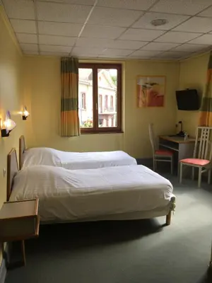 Un ou plusieurs lits dans un hébergement de l'établissement Hostellerie d'Alsace