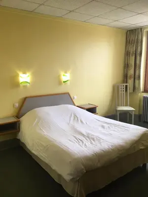 Un ou plusieurs lits dans un hébergement de l'établissement Hostellerie d'Alsace