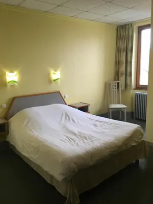 Un ou plusieurs lits dans un hébergement de l'établissement Hostellerie d'Alsace
