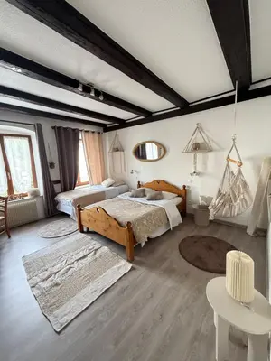 Un ou plusieurs lits dans un hébergement de l'établissement Chambres - zimmer Wistub Le PasSage