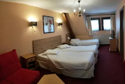 Un ou plusieurs lits dans un hébergement de l'établissement Hôtel Restaurant Beysang