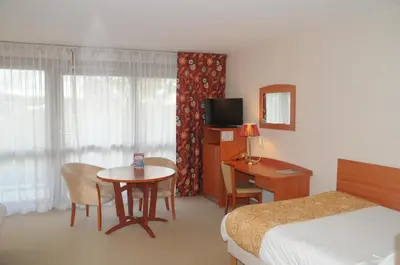 Un ou plusieurs lits dans un hébergement de l'établissement Hotel Cigoland