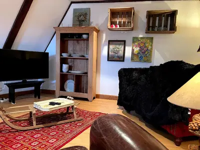 Télévision ou salle de divertissement dans l'établissement Gîte Le Chemin de Ronde