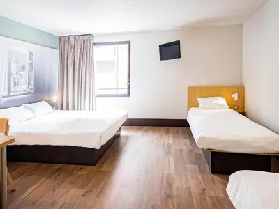 Un ou plusieurs lits dans un hébergement de l'établissement B&B HOTEL Mulhouse Centre
