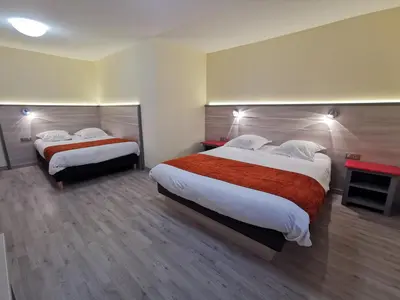 Un ou plusieurs lits dans un hébergement de l'établissement Hotel Restaurant Au Parc des Cigognes