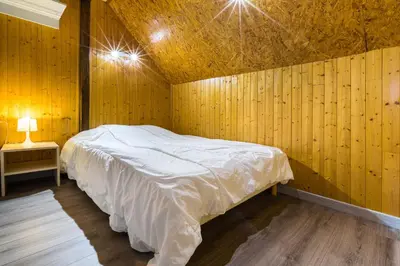 Un ou plusieurs lits dans un hébergement de l'établissement Chalets de la Wormsa