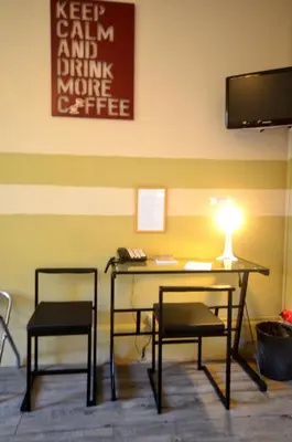 Télévision ou salle de divertissement dans l'établissement Hôtel Vauban
