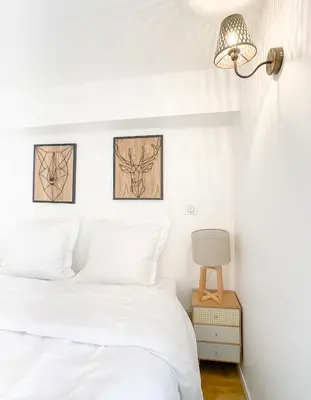 Un ou plusieurs lits dans un hébergement de l'établissement The downtown cosy apartments