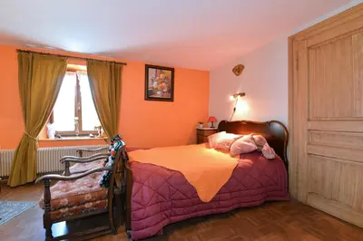 Un ou plusieurs lits dans un hébergement de l'établissement Gites ou Chambres d'hôtes à la ferme