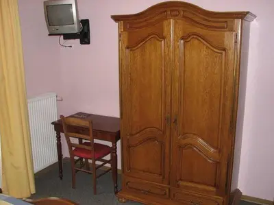 Télévision ou salle de divertissement dans l'établissement Le Soleil