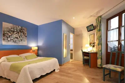Un ou plusieurs lits dans un hébergement de l'établissement Hotel Restaurant 3 Châteaux