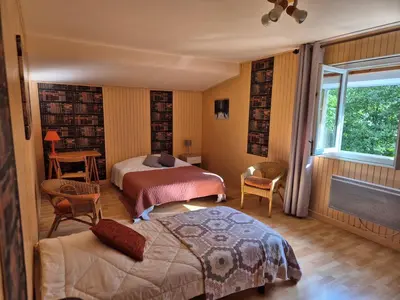 Un ou plusieurs lits dans un hébergement de l'établissement Chalet en Couleurs