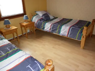 Un ou plusieurs lits dans un hébergement de l'établissement Maison bleue Petermann