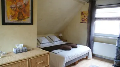 Un ou plusieurs lits dans un hébergement de l'établissement Chambre d'Hotes Le Vogelgarten