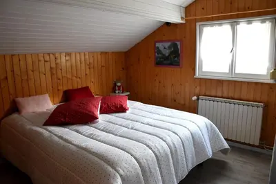 Un ou plusieurs lits dans un hébergement de l'établissement Gîte 60M2