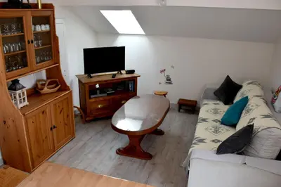 Télévision ou salle de divertissement dans l'établissement Gîte 60M2