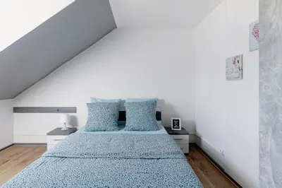 Un ou plusieurs lits dans un hébergement de l'établissement Comfort Stay Basel Airport 3B46