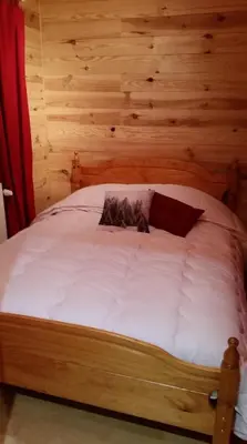 Un ou plusieurs lits dans un hébergement de l'établissement Chalet des Bruyères