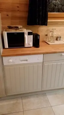 Cuisine ou kitchenette dans l'établissement Chalet des Bruyères