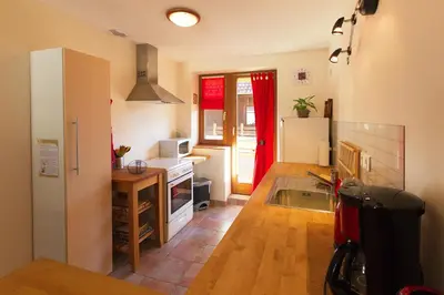Cuisine ou kitchenette dans l'établissement Gîte La Grange