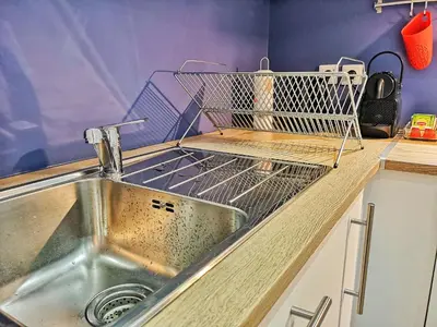 Cuisine ou kitchenette dans l'établissement Au p'tit Cordonnier