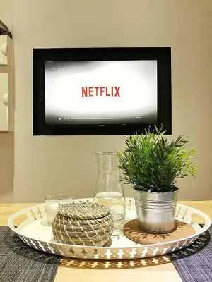 Télévision ou salle de divertissement dans l'établissement Au p'tit Cordonnier