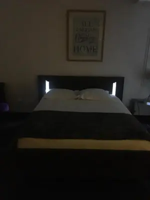 Un ou plusieurs lits dans un hébergement de l'établissement Les Appartements Berthe Molly