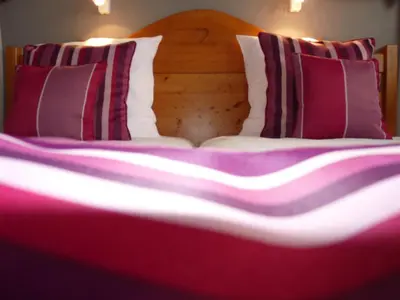 Un ou plusieurs lits dans un hébergement de l'établissement Hôtel Le Riquewihr