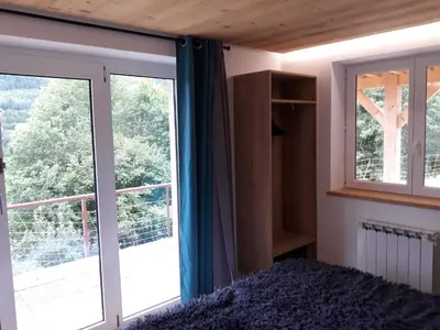 Un ou plusieurs lits dans un hébergement de l'établissement La maison des savoyards
