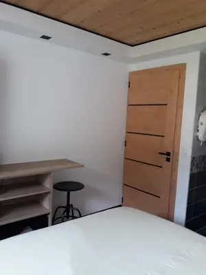 Un ou plusieurs lits dans un hébergement de l'établissement La maison des savoyards