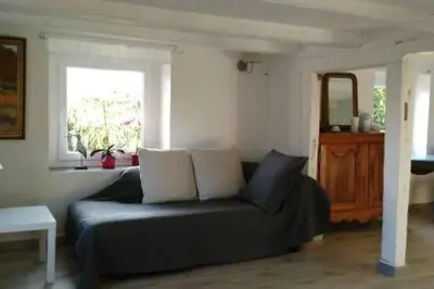 Coin salon dans l'établissement Chambre dans ancienne Ferme rénovée