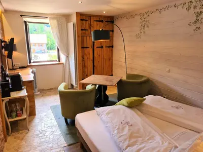 Un ou plusieurs lits dans un hébergement de l'établissement Domaine du Haut Jardin Hôtel & Chalets Spa Privé
