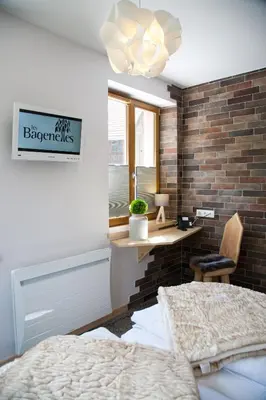 Un ou plusieurs lits dans un hébergement de l'établissement Hostellerie Les Bagenelles