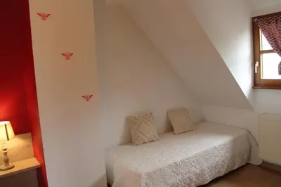 Un ou plusieurs lits dans un hébergement de l'établissement Maison d'Hôtes Sainte Hune Chambres et appartements