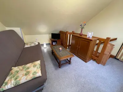 Coin salon dans l'établissement Apartment Résidence jaune et rose-4 by Interhome