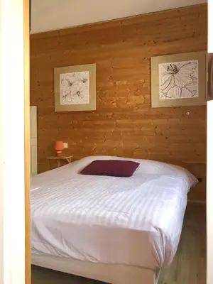 Un ou plusieurs lits dans un hébergement de l'établissement logis hôtel restaurant Le rendez-vous des Copains