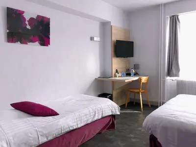 Un ou plusieurs lits dans un hébergement de l'établissement logis hôtel restaurant Le rendez-vous des Copains