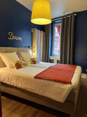 Un ou plusieurs lits dans un hébergement de l'établissement Hotel SPA Au Cheval Blanc