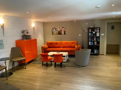 Coin salon dans l'établissement Hotel SPA Au Cheval Blanc