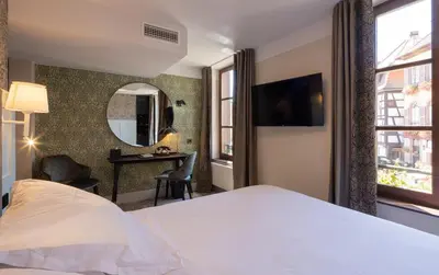 Un ou plusieurs lits dans un hébergement de l'établissement Logis Hôtel-Restaurant du Mouton