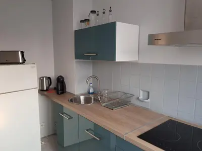 Cuisine ou kitchenette dans l'établissement Le Bellevue