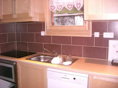 Cuisine ou kitchenette dans l'établissement Chalets les Marcels