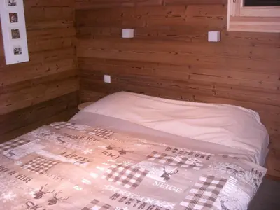 Un ou plusieurs lits dans un hébergement de l'établissement Chalets les Marcels