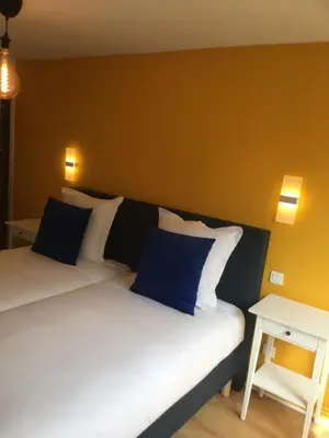 Un ou plusieurs lits dans un hébergement de l'établissement Les Appartements de Home Petite Venise