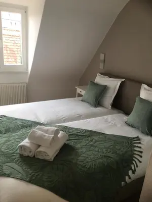 Un ou plusieurs lits dans un hébergement de l'établissement Les Appartements de Home Petite Venise